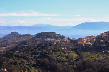 Obraz premium View to misty hills of Umbria and suburbs of Perugia, Umbria, Italy