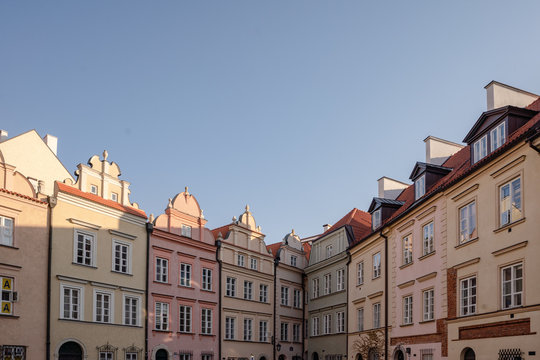 Fototapeta Street in Stare Miasto, Poland's capital Warshaw Old Town during sunrise.