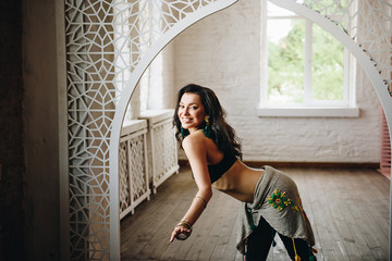 Belly dance costume. Costume for oriental dance. Eastern interior. Beautiful girl of eastern appearance. Dark long hair. Lessons Exercises. Movement in the dance. Bedleh or Beledi. Arab dance
