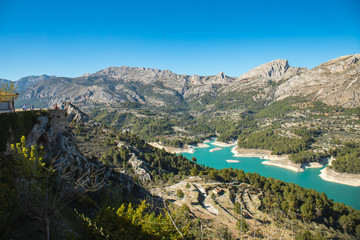 Wild nature with blue waters mountains and river near the castle of Guadalest in Alicante, Spain