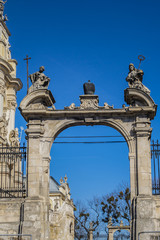 Fototapeta premium Double parade gate with baroque pediment and figures of saints to Lviv Greek Catholic Archbishop's Cathedral of Saint George (Ukr: Sobor sviatoho Yura, 1760). Lviv, Ukraine.