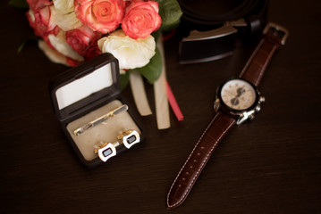 belt, shoes, butterfly, watch, attributes of clothes on an isolated wooden background