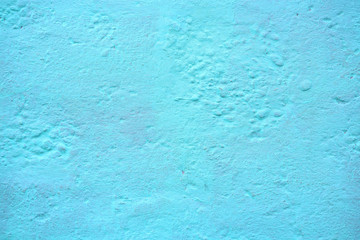 Fototapeta na wymiar Blue grunge concrete texture background. Rough blue painted cement surface.