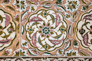Texture of ceramic tiles in oriental East style. Turkish ceramic tiles lined on the wall. Old azulejo pattern floral ornament on floor. Ottoman traditional art. Moroccan portuguese mosaic background
