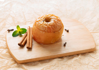 Apple baked with honey and cinnamon on burlap