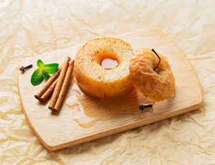 Apple baked with honey and cinnamon on burlap