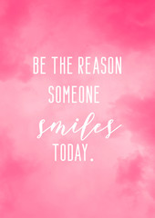 Be the reason someone smiles today. Daily motivational quote card with pink watercolor background.