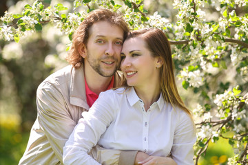 Fototapeta premium Young couple embracing smiling