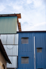 Fototapeta na wymiar Corrugated zinc skin wall for modern architecture in Penang, Malaysia.