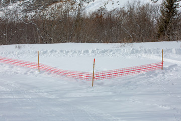 Road milestones and a red grid indicate a dangerous section of the route in the mountains. Norway