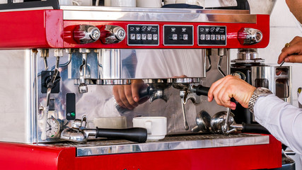 Close up of an expresso machine. An espresso machine in a restaurant with barista preparing a...
