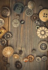 vintage buttons on old wooden boards