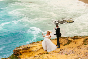 Beautiful wedding couple posing on beach