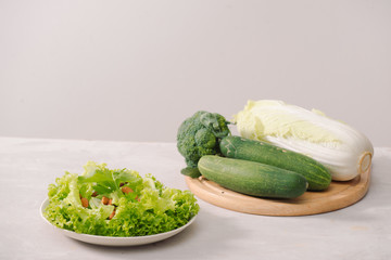Various green organic salad ingredients on white background. Healthy lifestyle or detox diet food concept