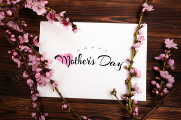 Happy mother's day lettering with a beautiful blossom flower