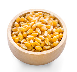 Corn seed on wooden dish isolated