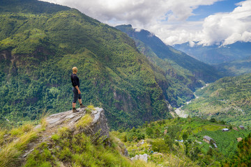 Fototapeta na wymiar Man standing on hill top in Himalayas