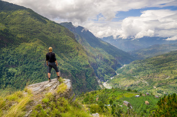 Fototapeta na wymiar Man standing on hill top in Himalayas