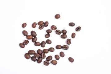Top view of Roasted coffee beans, dark Roast coffee background. Closeup top view pile of coffee beans on white background, space for text