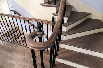 Staircase with cast iron balusters and wooden steps