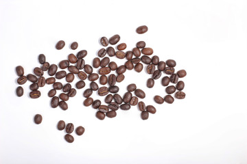 Top view of Roasted coffee beans, dark Roast coffee background. Closeup top view pile of coffee beans on white background, space for text