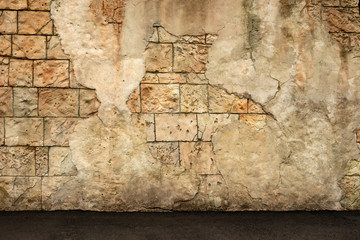 Fragment of an old wall from  coquina and collapsed plaster.  Stylized textured grunge background