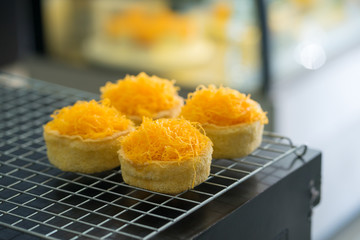 Gold Egg Yolk Thread Cakes on grill, Thai sweet food