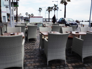 Street cafe and restaurant table and chair in Capri Island town in Italy at Naples. Landscape with Cafeteria at Italian coast. Anacapri in Europe. View in summer. Amalfi scenery