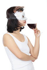 Chinese woman holding glass of wine isolated on white background