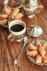 Turkish sweets with coffee on a wooden table