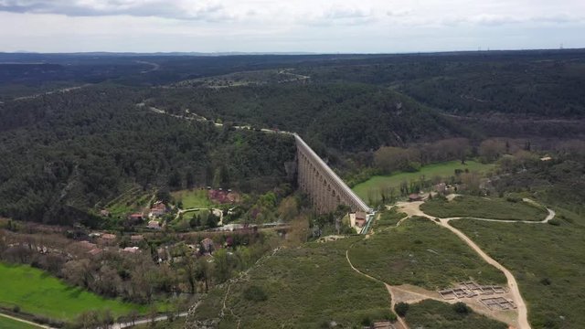 Aerial back traveling over the Aqueduct de Roquefavour national heritage site near Aix-en-Provence. Canal de Marseille 