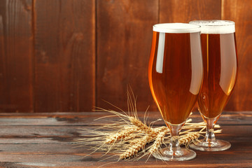 Glass beer on wood background