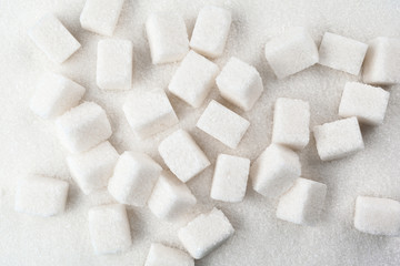  scoop with white sand and lump sugar close up background