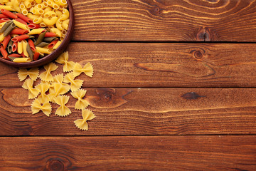 dried pasta on wooden background
