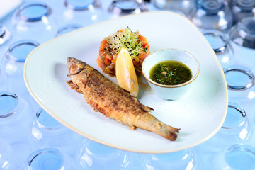 fried fish with vegetables and basil