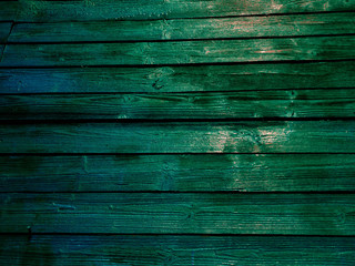Bright green fence. Green fence boards the close-up