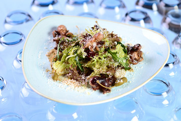 salad with octopus, arugula, capers and grated cheese