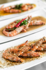 Obraz na płótnie Canvas portuguese seafood mixed traditional prawn tapas dishes on restaurant table