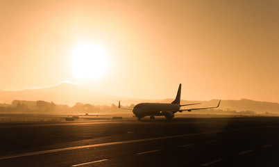 Fototapeta na wymiar Passenger airplane on the evening, sunset background.