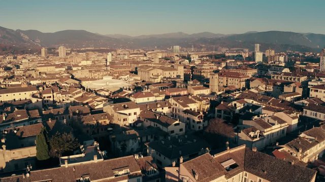 Low altitude aerial shot of cityscape of Terni and surrounding mountains. Umbria, Italy