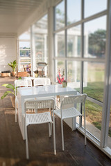 White table and chair in cargo container living room