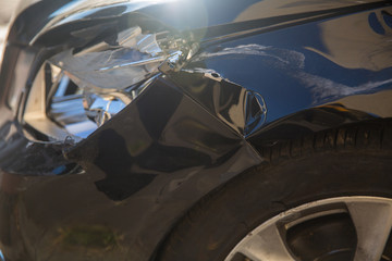 Car crash or accident. Front fender and light damage and scratches on bumper. Broken vehicle