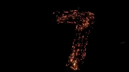 Number seven 7 burning, smoldering - Powered by Adobe