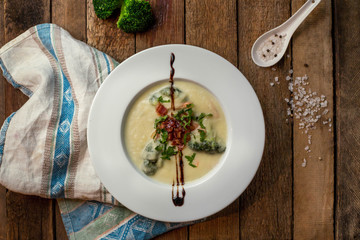 Dieting cauliflower cream soup with bacon. Salt. Ingredients. Homemade. Top view.