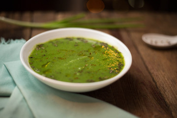 Homeamde orang sauce with onion, spices, pepper. Pesto sauce. Wooden tables. Salt. Top view.