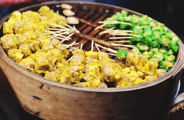 Many types of steamed dumplings for sale at street food in Thailand