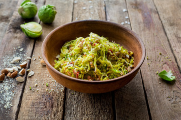 Paleo diet. Dieting salad with cabbage and nuts on the wooden table. Homemade. Dinner.