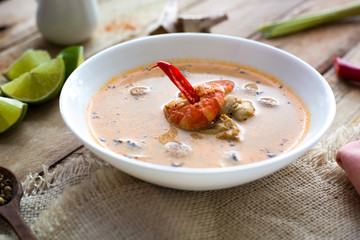 Soup with king prawns, seafoods, mussels. Lime and garlic. Spices and pepper. Top view. Diet. Dinner. Homemade