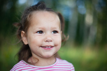 Lovely little girl outdoor portrait. Summertime, lifestyle