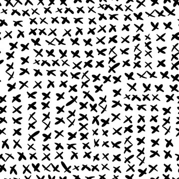 Abstract black and white vector seamless pattern with hand drawn doodle small crosses for textile, clothing and backgrounds